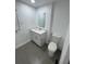 Clean, well-lit bathroom with modern fixtures, including a vanity and toilet at 400 Vermont Ave, St Cloud, FL 34769