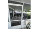 Relaxing screened-in porch with comfortable seating, offering an inviting outdoor living space at 400 Vermont Ave, St Cloud, FL 34769