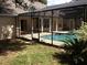 Enclosed pool area showing door access and the swimming pool at 4820 Wingrove Blvd, Orlando, FL 32819