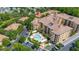 Beautiful condo complex with a pool, palm trees, meticulously maintained grounds, and parking at 502 Mirasol Cir # 103, Kissimmee, FL 34747