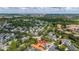Gorgeous aerial view of community featuring various home styles, mature trees, and a vibrant neighborhood setting at 502 Mirasol Cir # 103, Kissimmee, FL 34747