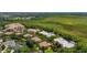 Aerial view showcases the neighborhood's mix of townhomes, condominiums, and lush green landscaping at 502 Mirasol Cir # 103, Kissimmee, FL 34747