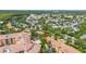 Scenic aerial view showcasing a complex surrounded by water, houses, and manicured landscaping at 502 Mirasol Cir # 103, Kissimmee, FL 34747