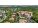 Stunning aerial view showcasing the luxurious condo complex surrounded by lush greenery at 502 Mirasol Cir # 103, Kissimmee, FL 34747