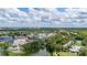 Scenic aerial view of a vibrant community with lush green spaces, waterfront features and inviting architecture at 502 Mirasol Cir # 103, Kissimmee, FL 34747