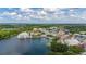 Beautiful aerial view of a lakeside community showcasing its charming architecture, waterfront access, and lush green landscaping at 502 Mirasol Cir # 103, Kissimmee, FL 34747