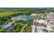 Aerial view of a stunning lakefront community, featuring a mix of residential, retail, and recreational amenities at 502 Mirasol Cir # 103, Kissimmee, FL 34747