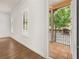 Balcony view with wood-look tile and plantation shutters overlooking the neighborhood pool at 502 Mirasol Cir # 103, Kissimmee, FL 34747