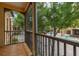 Screened balcony with beautiful views of mature trees, courtyard, and neighborhood water feature at 502 Mirasol Cir # 103, Kissimmee, FL 34747