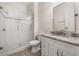 Bathroom features glass shower, marble vanity with modern sink, and updated tile at 502 Mirasol Cir # 103, Kissimmee, FL 34747