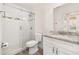 Bathroom featuring a glass-enclosed shower with subway tile and marble vanity at 502 Mirasol Cir # 103, Kissimmee, FL 34747