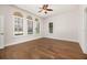 Bright bedroom with hardwood floors and many windows with plantation shutters at 502 Mirasol Cir # 103, Kissimmee, FL 34747