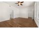 Spacious bedroom with hardwood floors, ceiling fan, multiple closets and access to bathroom at 502 Mirasol Cir # 103, Kissimmee, FL 34747