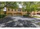 Two-story Mediterranean-style home with a two-car garage, mature trees and shrubs at 502 Mirasol Cir # 103, Kissimmee, FL 34747