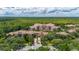 Breathtaking aerial view of property, featuring lush greenery, ponds and Mediterranean-style condos at 502 Mirasol Cir # 103, Kissimmee, FL 34747