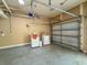 Spacious garage featuring washer, dryer and overhead door with automatic opener at 502 Mirasol Cir # 103, Kissimmee, FL 34747