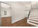 Hallway with hardwood floors, stairs, closet and door to bedroom at 502 Mirasol Cir # 103, Kissimmee, FL 34747