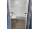 Cozy bathroom with tile flooring and a shower-tub combo at 5449 Nw 2Nd St, Ocala, FL 34482
