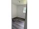 Cozy bedroom with modern vinyl flooring and a window at 5449 Nw 2Nd St, Ocala, FL 34482