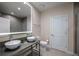 Modern bathroom featuring double sinks, a large mirror, and contemporary fixtures at 5573 Torino Rd, Kissimmee, FL 34746