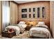 Charming bedroom with exposed brick wall, vintage decor, and matching twin beds at 5573 Torino Rd, Kissimmee, FL 34746