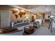 Inviting living room with modern decor, a comfortable sofa, and an open layout flowing into the kitchen, ideal for entertaining at 5573 Torino Rd, Kissimmee, FL 34746