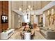 Spacious living room featuring modern decor, unique lighting fixtures, and hardwood floors at 5573 Torino Rd, Kissimmee, FL 34746