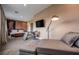 Main bedroom offering modern industrial decor, sleek furniture, and a comfortable seating area at 5573 Torino Rd, Kissimmee, FL 34746