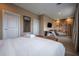 Comfortable main bedroom features a desk, lounge chair, and bright natural lighting at 5573 Torino Rd, Kissimmee, FL 34746