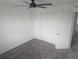 A bedroom contains a carpeted floor, ceiling fan, walk-in closet and a window at 5793 Gingham Dr, Kissimmee, FL 34758