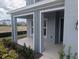 Inviting front porch with modern columns and landscaping, great for relaxing outdoors at 5793 Gingham Dr, Kissimmee, FL 34758
