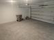 Spacious two car garage with painted walls, epoxy floor and overhead door at 5793 Gingham Dr, Kissimmee, FL 34758