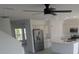 Modern kitchen featuring stainless steel appliances and a kitchen island with a sink at 5793 Gingham Dr, Kissimmee, FL 34758