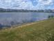 Scenic view of a tranquil pond, adding natural beauty and privacy to the property at 5793 Gingham Dr, Kissimmee, FL 34758