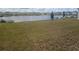 Picturesque pond view from the backyard, enhanced by mature trees and a peaceful atmosphere at 5793 Gingham Dr, Kissimmee, FL 34758