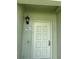 Inviting front door with stylish details and a secure entrance; home address displayed above at 5861 La Costa Dr # 115, Orlando, FL 32807