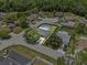 Aerial view of a single-Gathering home, large backyard, and screened-in pool at 6528 Shepherd Oaks Pass, Lakeland, FL 33811