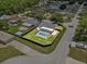 Aerial view of single-Gathering home in a neighborhood featuring a private, fenced-in pool at 6528 Shepherd Oaks Pass, Lakeland, FL 33811