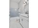 Bathroom featuring a tub with blue tiling and white vanity at 6528 Shepherd Oaks Pass, Lakeland, FL 33811