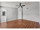 Large primary bedroom with ceiling fan and wood-look flooring at 6528 Shepherd Oaks Pass, Lakeland, FL 33811