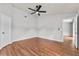 Spacious bedroom with ceiling fan and wood-look flooring at 6528 Shepherd Oaks Pass, Lakeland, FL 33811