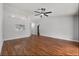 Open living room with hardwood floors, ceiling fan and natural light at 6528 Shepherd Oaks Pass, Lakeland, FL 33811