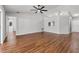 Large living room with hardwood floors, ceiling fan, and natural light at 6528 Shepherd Oaks Pass, Lakeland, FL 33811
