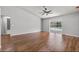 Main bedroom features hardwood floors and sliding glass doors to the screened in pool at 6528 Shepherd Oaks Pass, Lakeland, FL 33811