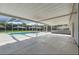 Spacious covered patio area with screen enclosure, providing shade and a great view of the pool and backyard at 6528 Shepherd Oaks Pass, Lakeland, FL 33811