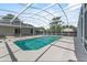 A screened pool in a backyard with a patio at 6528 Shepherd Oaks Pass, Lakeland, FL 33811