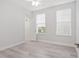 Bright bedroom with light grey floors and neutral paint, ideal for creating a relaxing space at 7266 Desert Mandarin St, Winter Garden, FL 34787