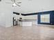 Bright open-concept kitchen and dining area with tile floors, stainless appliances, and large island at 7266 Desert Mandarin St, Winter Garden, FL 34787