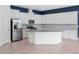 Spacious kitchen with ample cabinet space, stainless steel appliances, and center island at 7266 Desert Mandarin St, Winter Garden, FL 34787