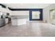 Modern kitchen with granite countertops, stainless steel appliances, and tile flooring at 7266 Desert Mandarin St, Winter Garden, FL 34787